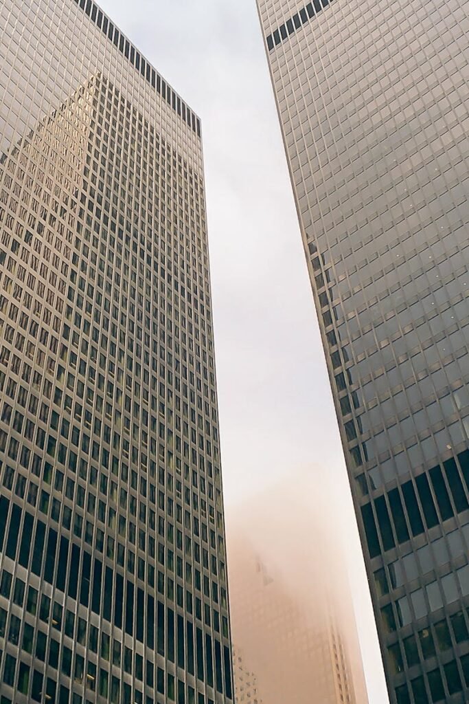Toronto skyscrapers against a cloudy sky, showcasing urban architecture.
